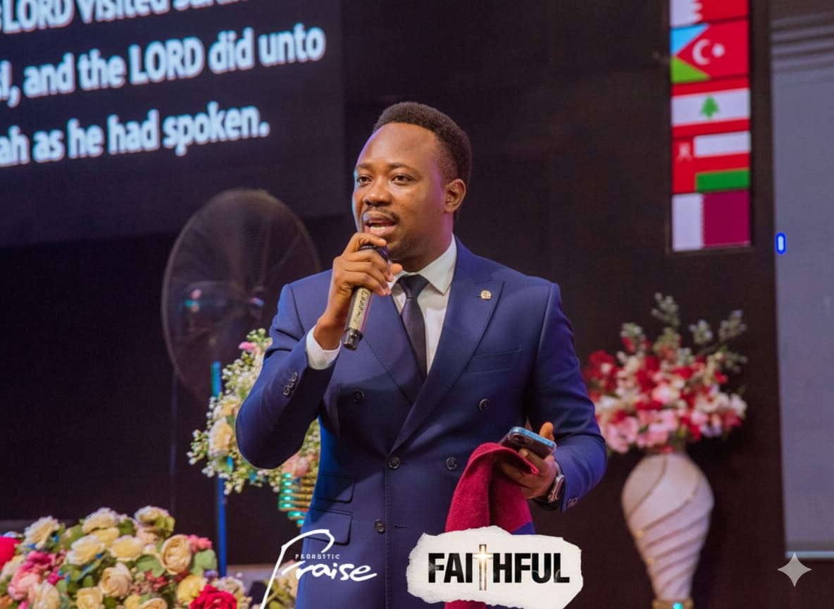 Pastor Cylars ministering with a microphone